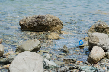 Empty plastic garbage dumped in the water
