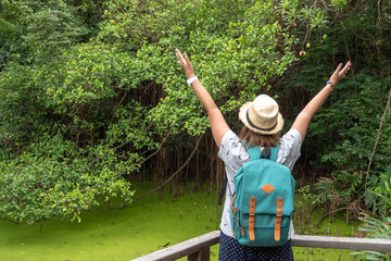 Portrait of woman traveling alone in the natural forest,  rewarding experiences that you can decide...