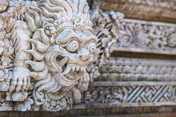 Traditional Balinese stone sculpture art and culture at Bali, Indonesia. Architecture, traveling and religion.