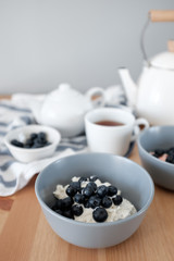Healthy breakfast with cottage cheese and blueberries