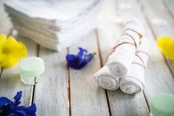 Rolled up white spa towels, selective focus, vintage