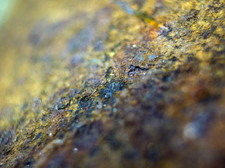 multi-colored paint on uneven surface