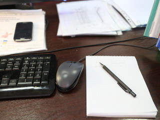 Fototapeta na wymiar Keyboard, mouse, notebook on the table