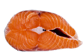 Fresh salmon steak isolated on the white background. Salmon Red Fish Steak. Large Pile of trout steak. Big organic steaks of salmon lined up. Big pieces raw salmon.