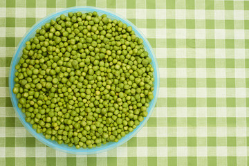 Fresh green peas background texture top view
