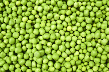 Fresh green peas background texture top view
