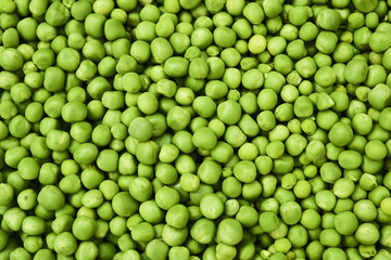 Fresh green peas background texture top view

