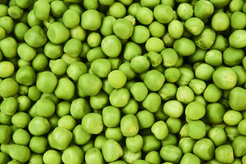 Fresh green peas background texture top view
