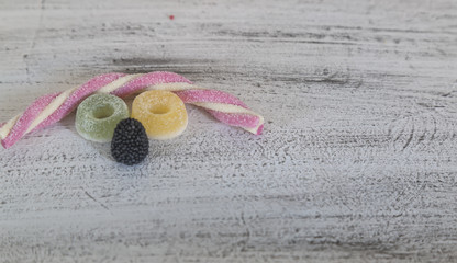 colorful candies on the grey background