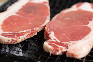 Beef steak put on grill , High energy foods. Image use for cook in the kitchen.