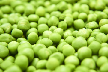 Fresh green peas background texture top view
