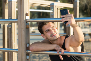 Athletic man making selfie outdoors