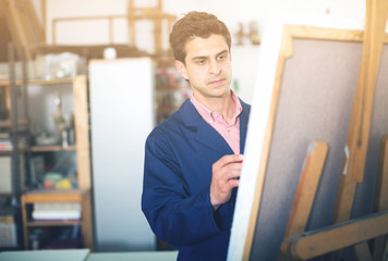 Artist painting on canvas