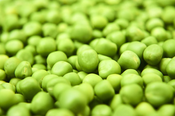 Fresh green peas background texture top view
