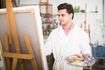 Male artist drawing in studio