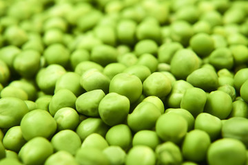 Fresh green peas background texture top view
