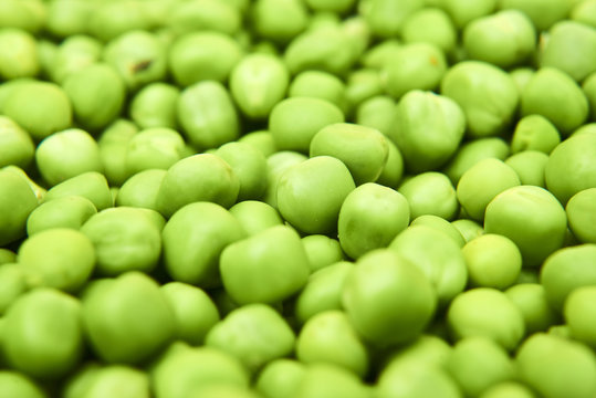 Fresh green peas background texture top view
