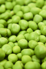 Fresh green peas background texture top view
