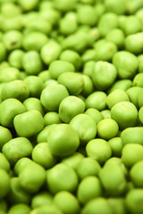 Fresh green peas background texture top view
