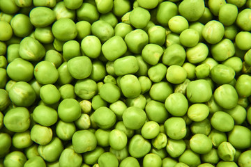 Fresh green peas background texture top view
