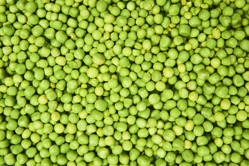 Fresh green peas background texture top view
