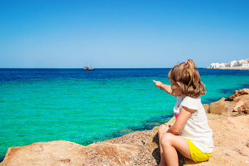 Child girl on the background of the sea. Tunisia Mahdia. Selective focus.