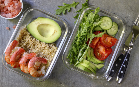 Healthy meal prep containers with quinoa and shrimp