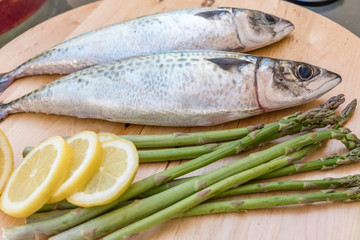 raw mackerel on wooden board