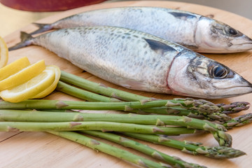 raw mackerel on wooden board