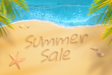 Fototapeta na wymiar Summer sale written on beach. Summer time travel and relax. Summer discount concept.
