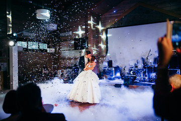Wedding dance of happy couple in the restaurant 