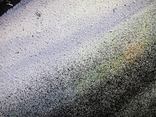 multi-colored paint on uneven surface