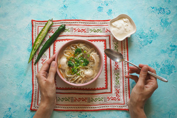 Zama, romanian and moldavian chicken soup with noodle. Traditional hangover soup is served with hot...