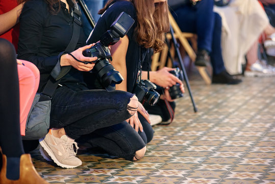 Crowd Of Journalists Taking Photo At Fashion Week Presentation