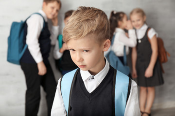 Children bullying their classmate indoors