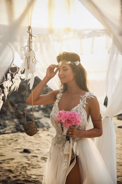 Beautiful and sensual bride on the beach