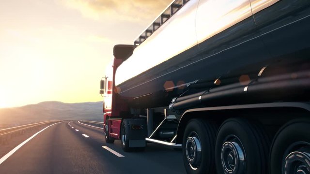 The camera follows a tank truck driving along a desert highway into the sunset. Low angle rear view camera. Realistic high quality 3d animation.