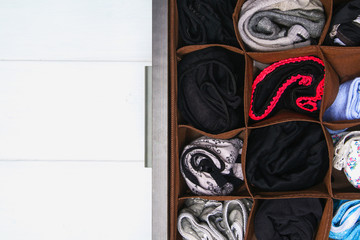 Organization of storage of socks and panties in the drawer of the chest of drawers, cabinet.
