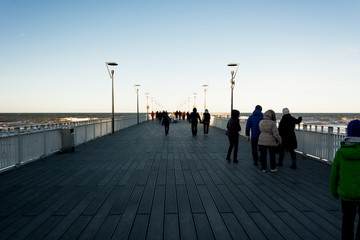 walking people on the pier