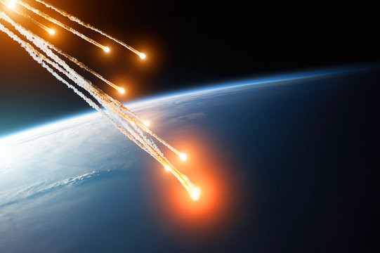 Fototapeta Falling burning flares of several meteorites of asteroids in the Earth's atmosphere. Elements of this image furnished by NASA.