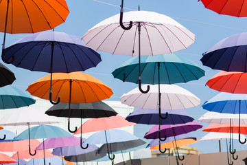Fototapeta na wymiar Avenue of floating umbrellas