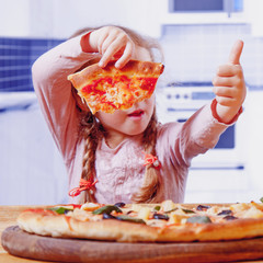 Little child girl holding pizza slices as symbol of best food. (Joy, childhood, nutrition concept)