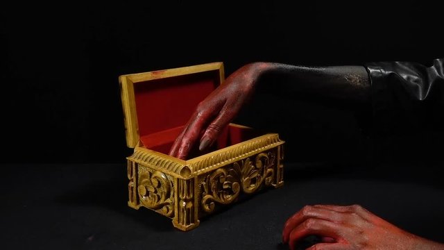 Woman's bloody hands touching crawling maggots