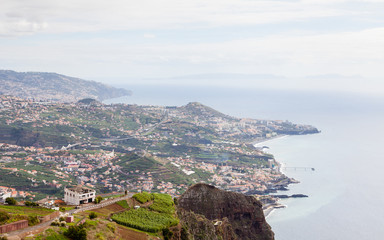Fototapeta na wymiar Cabo Girao View. The view looking towards Funchal from Cabo Girao viewpoint on the Portuguese island of Madeira.