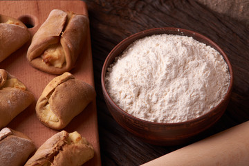 Close up Flour bread and whole grain , rolling pin and Cottage cheese cookies. Concept of homemade food
