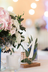 White figure on glass. Number of a table