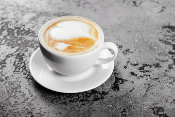 Cappuccino coffee on gray table background