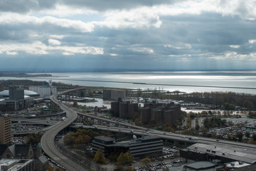Obraz premium View of the highway and Erie Basin waterfront in Buffalo New York. View of piers and boats from a high vantage point of Buffalo waterfront in upstate New York right before the rain comes.