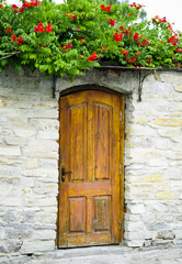 Old wooden door in poor quarter