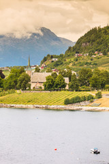 Mountains and fjord with village Norway.